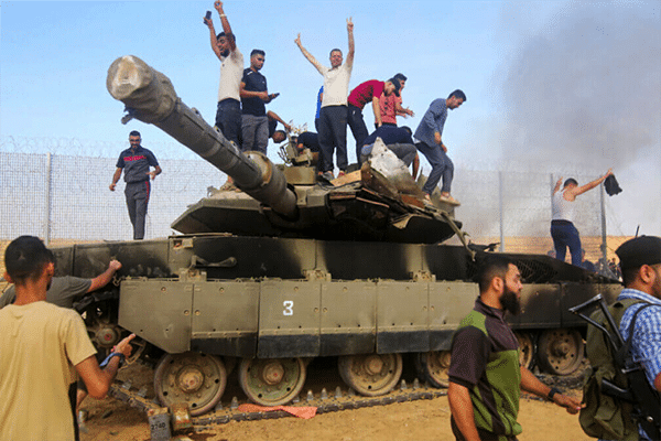 | PALESTINIANS TAKE CONTROL OF AN ISRAELI TANK AFTER CROSSING THE BORDER FENCE WITH ISRAEL FROM KHAN YUNIS IN THE SOUTHERN GAZA STRIP ON OCTOBER 7 2023 PHOTO STRINGER APA IMAGES | MR Online